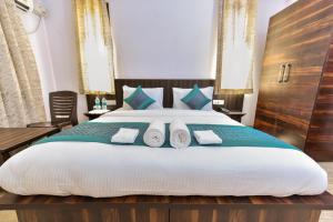 Voodi või voodid majutusasutuse Hotel Shivaye Residency, Gurgaon toas