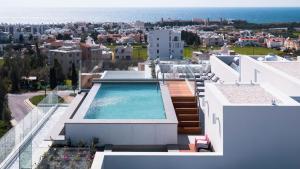 a house with a swimming pool on top of it at Premier 403 3 bedroom penthouse in Paphos