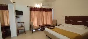 Ένα ή περισσότερα κρεβάτια σε δωμάτιο στο Riverok Resorts +18 φωτογραφίες