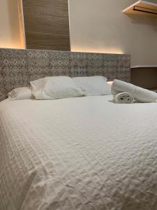 Un ou plusieurs lits dans un hébergement de l'établissement Hostal Acemar