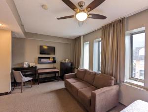 a living room with a couch and a desk at King Edward Hotel in Banff