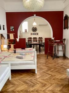 a living room with two beds and a dining room at Central Apartments of Budapest in Budapest
