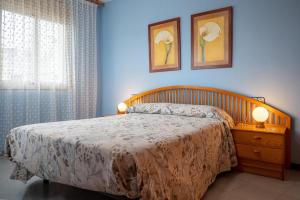 Ένα ή περισσότερα κρεβάτια σε δωμάτιο στο AT128 Cerca del centro, playa a 10 min a pie