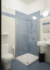 a bathroom with a shower and a toilet and a sink at Brora Family Village in Lido di Savio