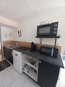Kuchyň nebo kuchyňský kout v ubytování Le cosy