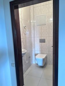 a bathroom with a toilet and a sink at Beautiful Villa near the airport & city in Trabzon
