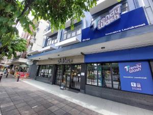 a store front of a building on a street at HOUSEMODE - BAANYAI @ Wongwian Yai in Bangkok