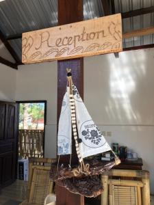 a wooden model of a pirate ship on a table at La Bohème in Gili Air