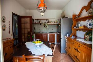 Kuchyň nebo kuchyňský kout v ubytování MAGIA & EMOZIONI - Trecastagni- Falde ETNA Villa vista mare