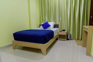Postel nebo postele na pokoji v ubytování Tourist Inn