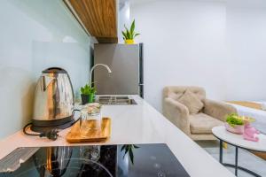 a kitchen with a tea kettle on a counter at Spring Hill Apartment -The High Class in Ho Chi Minh City