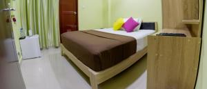 Postel nebo postele na pokoji v ubytování Tourist Inn