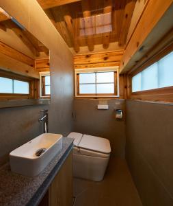 a bathroom with a white toilet and a sink at Luxury hanok with private bathtub - SN01 in Seoul