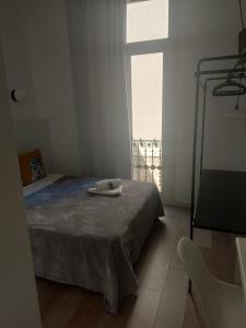 Posteľ alebo postele v izbe v ubytovaní Hostal Argo