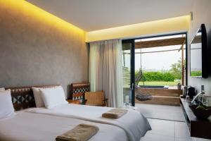 Posteľ alebo postele v izbe v ubytovaní La Mer Resort Spa Crete