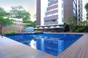a swimming pool in the middle of a building at Swiss-Belhotel Pondok Indah in Jakarta