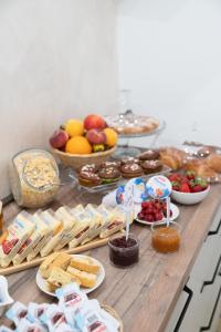 a table topped with lots of different types of food at B&B SAN NILO in Orsomarso