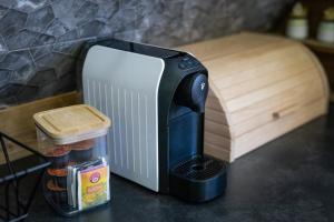 a toaster sitting on top of a counter with some food at Zacisze Pod Reglami in Zakopane