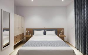 Postel nebo postele na pokoji v ubytování Zephyros Hotel