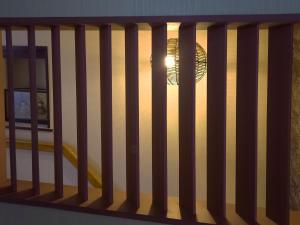 a view of a room with a railing with a window at HOTEL HOUSE LEE in Tokyo