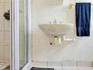 a bathroom with a sink and a shower at Wiggins Self Catering in Jacobs Bay