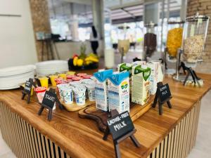 a counter with some food items on a table at Zlatni Rat Beach Resort in Bol