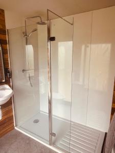 a shower with a glass door in a bathroom at Casterton stays 