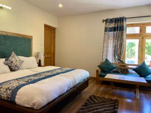 Postel nebo postele na pokoji v ubytování Hotel Palam Hills