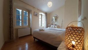 Postel nebo postele na pokoji v ubytování Relais du Noble Voyageur