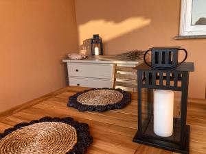 a room with two rugs and a table with a candle at Bella vista in Corralejo