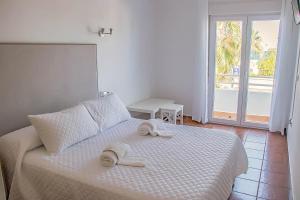 Cama o camas de una habitación en H Rincón de Diego