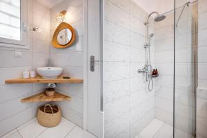 a bathroom with a shower and a sink at Seaside Secret by BluPine in Athens