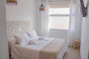 Cama o camas de una habitación en H Rincón de Diego