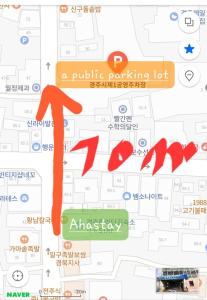 a map of a parking lot with a red arrow at Aha Stay in Gyeongju