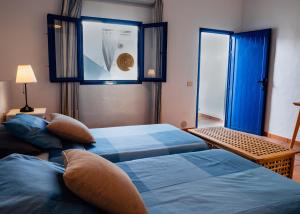 Giường trong phòng chung tại Casa Azul