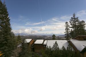 a view of snow covered roofs of houses and trees at Timber Ridge Resort by 101 Great Escapes in Mammoth Lakes +1 photo