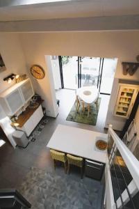 an aerial view of a kitchen with a table and chairs at GASSPON - Golfe de St-Tropez - Mazet dans domaine privé avec piscine et tennis in Cogolin