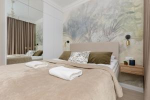 Posteľ alebo postele v izbe v ubytovaní Pozytywny Mokotów Apartment with Balcony Warsaw by Noclegi Renters
