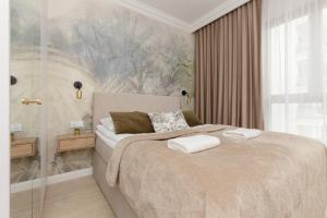 Posteľ alebo postele v izbe v ubytovaní Pozytywny Mokotów Apartment with Balcony Warsaw by Noclegi Renters