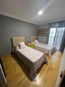 Postel nebo postele na pokoji v ubytování 1ra Linea Platja de Sant Feliu