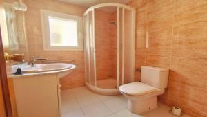 a bathroom with a toilet and a shower and a sink at Apartamento Costamar by VACAY L'Escala in L'Escala +24 photos