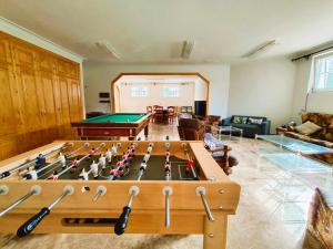 a living room with a pool table in it at La Casona Imperial in Alpedrete