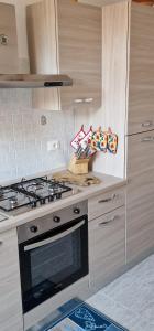 Kuchyňa alebo kuchynka v ubytovaní Casa Ilanfra - appartamenti Gabbiano, Farfalla e Stella Marina