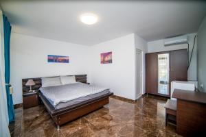 Postel nebo postele na pokoji v ubytování Vila Tributte