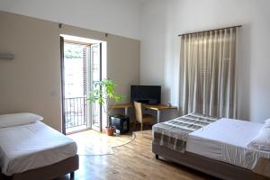 Postel nebo postele na pokoji v ubytování Lungomare Suite & Spa