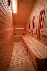an empty sauna with wooden walls and wooden floors at Zacisze Pod Reglami & Sauna in Zakopane