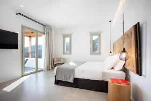 Ένα ή περισσότερα κρεβάτια σε δωμάτιο στο Villa Chanel by Blanco Villas +43 φωτογραφίες