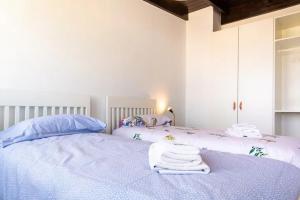 En eller flere senge i et værelse på Casa Los Lagos 1CD El Cotillo