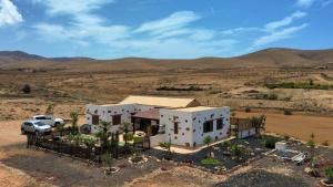 an aerial view of a house in the desert at Cloud Country in Llanos de la Concepción