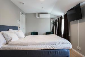 Postel nebo postele na pokoji v ubytování Hotell MAVI
